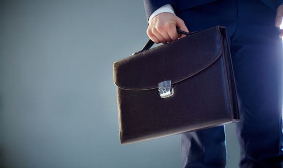 isolated_image_of_a_businessman_carrying_a_briefcase_sbi_300726244.jpg